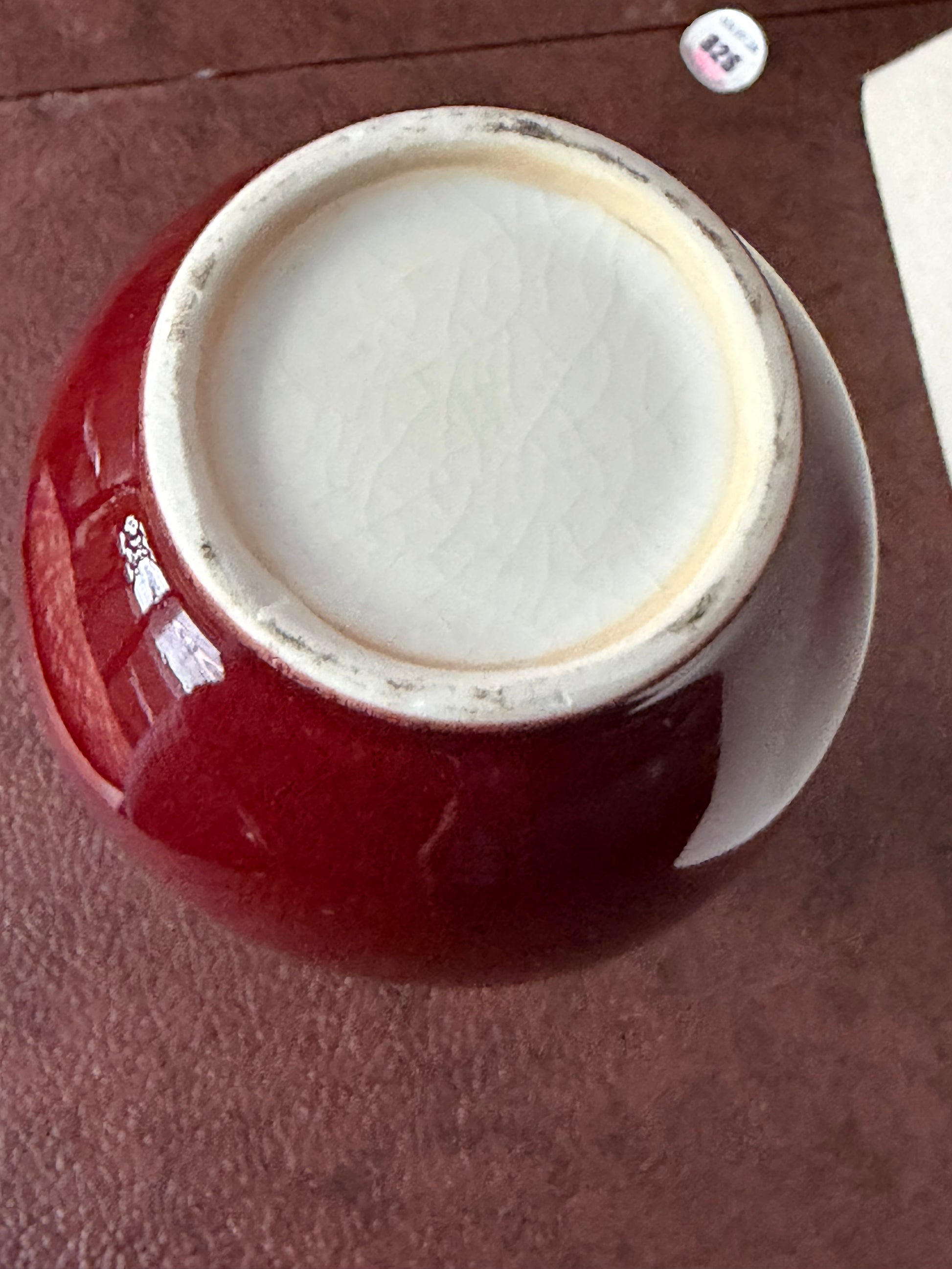 white base of a red porceain vase